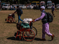 Kashmiri polling officials carry sealed Electronic Voting Machines (EVM) and Voter Verifiable Paper Audit Trail (VVPAT) machines as they mov...