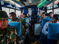 Kashmiri polling officials carry sealed Electronic Voting Machines (EVM) and Voter Verifiable Paper Audit Trail (VVPAT) machines as they mov...