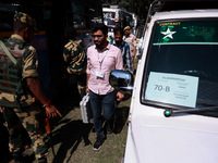 Kashmiri polling officials carry sealed Electronic Voting Machines (EVM) and Voter Verifiable Paper Audit Trail (VVPAT) machines as they mov...