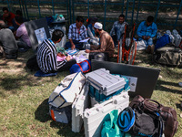 Kashmiri polling officials carry sealed Electronic Voting Machines (EVM) and Voter Verifiable Paper Audit Trail (VVPAT) machines as they mov...