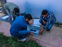 Kashmiri polling officials carry sealed Electronic Voting Machines (EVM) and Voter Verifiable Paper Audit Trail (VVPAT) machines as they mov...