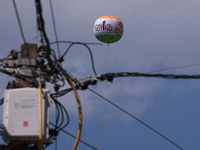 A gas-filled ball carries a message to cast a vote for the third phase of elections in Jammu and Kashmir, India, on October 1, 2024. (