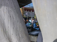 Polling officials with electronic voting machines (EVM) gather at a distribution center in Sumbal Area of Bandipora District, North of Srina...