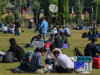 Polling officials with electronic voting machines (EVM) gather at a distribution center in Sumbal Area of Bandipora District, North of Srina...