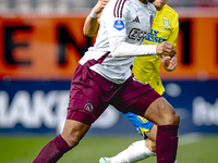 AFC Ajax Amsterdam defender Devyne Rensch and RKC player Dario van de Buijs during the match RKC - Ajax at the Mandemakers Stadium for the D...