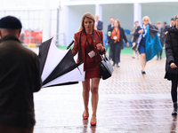 Delegates arrive in the pouring rain to the Conservative Party Conference at the International Conference Centre in Birmingham, United Kingd...