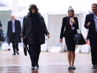 Delegates arrive in the pouring rain to the Conservative Party Conference at the International Conference Centre in Birmingham, United Kingd...