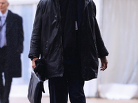 Delegates arrive in the pouring rain to the Conservative Party Conference at the International Conference Centre in Birmingham, United Kingd...