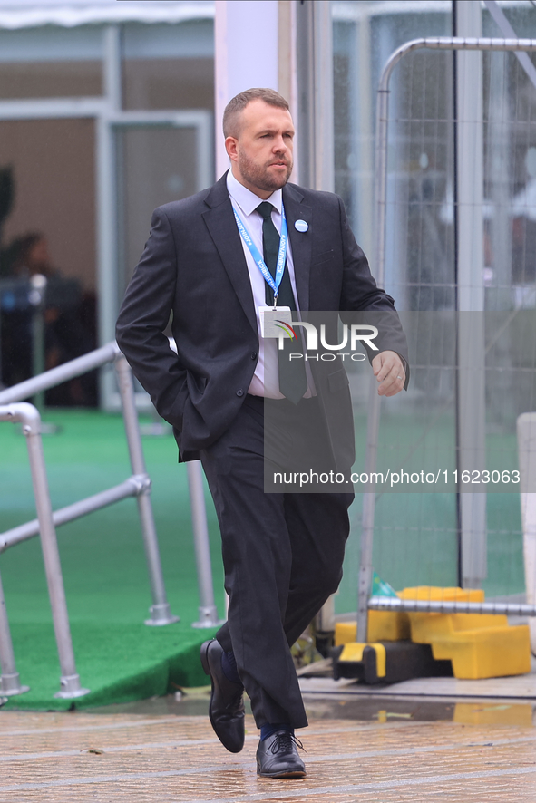 Jonathan Gullis arrives in the pouring rain at the Conservative Party Conference at the International Conference Centre in Birmingham, Engla...