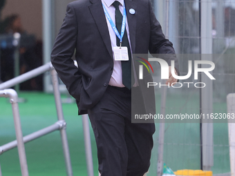 Jonathan Gullis arrives in the pouring rain at the Conservative Party Conference at the International Conference Centre in Birmingham, Engla...