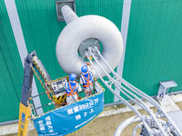 Maintenance personnel carry out a comprehensive overhaul of equipment at the annual maintenance site of the 800 kV Huai'an Converter station...