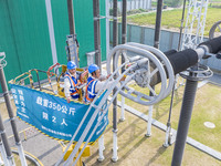 Maintenance personnel carry out a comprehensive overhaul of equipment at the annual maintenance site of the 800 kV Huai'an Converter station...