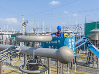 Maintenance personnel carry out a comprehensive overhaul of equipment at the annual maintenance site of the 800 kV Huai'an Converter station...