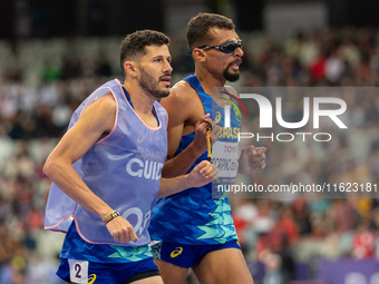 Julio Cesar Agripino dos Santos of Team Brazil celebrates with guide Romario Santos Viana a new World Record of 14:48:85 in the Men's 5000m...