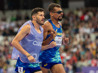 Julio Cesar Agripino dos Santos of Team Brazil celebrates with guide Romario Santos Viana a new World Record of 14:48:85 in the Men's 5000m...