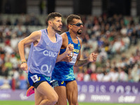 Julio Cesar Agripino dos Santos of Team Brazil celebrates with guide Romario Santos Viana a new World Record of 14:48:85 in the Men's 5000m...