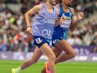 Julio Cesar Agripino dos Santos of Team Brazil celebrates with guide Romario Santos Viana a new World Record of 14:48:85 in the Men's 5000m...