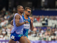 Julio Cesar Agripino dos Santos of Team Brazil celebrates with guide Romario Santos Viana a new World Record of 14:48:85 in the Men's 5000m...