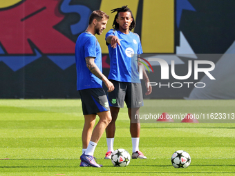 Jules Kounde and Inigo Martinez train at the Joan Gamper sports city before the Champions League match against Young Boys in Barcelona, Spai...