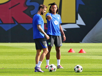 Jules Kounde and Inigo Martinez train at the Joan Gamper sports city before the Champions League match against Young Boys in Barcelona, Spai...