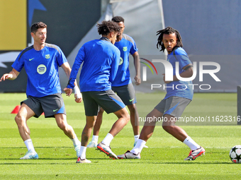 Jules Kounde, Ansu Fati, Raphinha Dias, and Robert Lewandowski train during an FC Barcelona session at the Joan Gamper sports city, prior to...