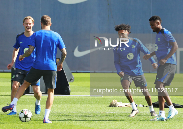 Frenkie de Jong, Ansu Fati, and Raphinha Dias train at the Joan Gamper sports city before the Champions League match against Young Boys in B...