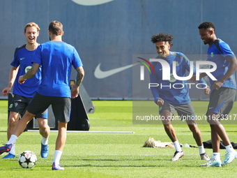 Frenkie de Jong, Ansu Fati, and Raphinha Dias train at the Joan Gamper sports city before the Champions League match against Young Boys in B...