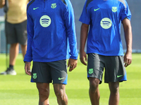 Raphinha Dias and Ansu Fati train with FC Barcelona at the Joan Gamper sports city before the Champions League match against Young Boys in B...