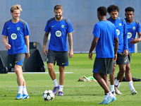 Frenkie de Jong and Inigo Martinez train at the Joan Gamper sports city prior to the Champions League match against Young Boys in Barcelona,...