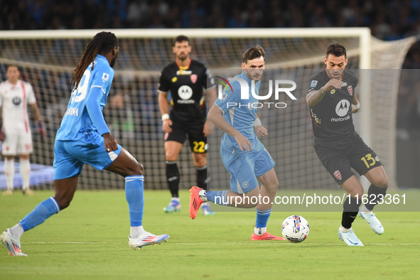 Pedro Pereira of AC Monza competes for the ball with Khvicha Kvaratskhelia of SSC Napoli during the Serie A match between SSC Napoli and AC...