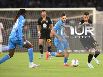 Pedro Pereira of AC Monza competes for the ball with Khvicha Kvaratskhelia of SSC Napoli during the Serie A match between SSC Napoli and AC...