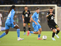 Pedro Pereira of AC Monza competes for the ball with Khvicha Kvaratskhelia of SSC Napoli during the Serie A match between SSC Napoli and AC...