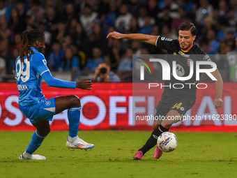 Andrea Carboni of AC Monza competes for the ball with Andre-Frank Zambo Anguissa of SSC Napoli during the Serie A match between SSC Napoli a...