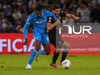 Andrea Carboni of AC Monza competes for the ball with Andre-Frank Zambo Anguissa of SSC Napoli during the Serie A match between SSC Napoli a...