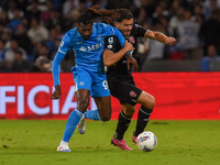 Andrea Carboni of AC Monza competes for the ball with Andre-Frank Zambo Anguissa of SSC Napoli during the Serie A match between SSC Napoli a...