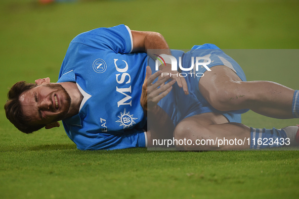 Khvicha Kvaratskhelia of SSC Napoli lies injured during the Serie A match between SSC Napoli and AC Monza at Stadio Diego Armando Maradona N...