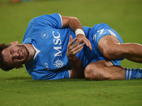 Khvicha Kvaratskhelia of SSC Napoli lies injured during the Serie A match between SSC Napoli and AC Monza at Stadio Diego Armando Maradona N...