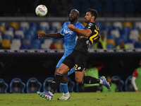 Pablo Mari of AC Monza competes for the ball with Romelu Lukaku of SSC Napoli during the Serie A match between SSC Napoli and AC Monza at St...