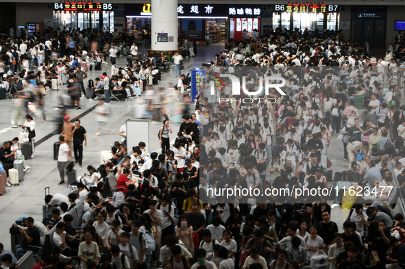 Passengers are seen in a waiting room at Nanchang Railway Station in Nanchang, China, on September 30, 2024. 