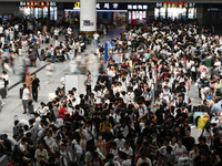 Passengers are seen in a waiting room at Nanchang Railway Station in Nanchang, China, on September 30, 2024. (