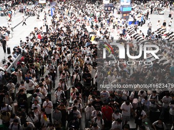 Passengers are seen in a waiting room at Nanchang Railway Station in Nanchang, China, on September 30, 2024. (