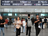 Passengers are seen in a waiting room at Nanchang Railway Station in Nanchang, China, on September 30, 2024. (