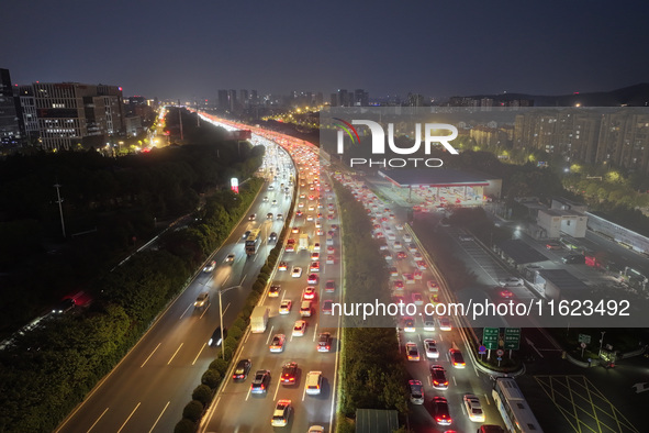 A photo taken on September 30, 2024, shows congestion on several expressways during the National Day holiday in Nanjing, China. 