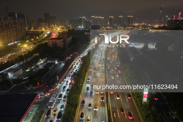 A photo taken on September 30, 2024, shows congestion on several expressways during the National Day holiday in Nanjing, China. 