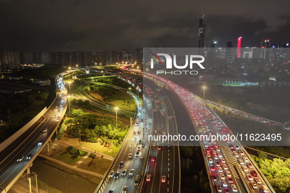 A photo taken on September 30, 2024, shows congestion on several expressways during the National Day holiday in Nanjing, China. 