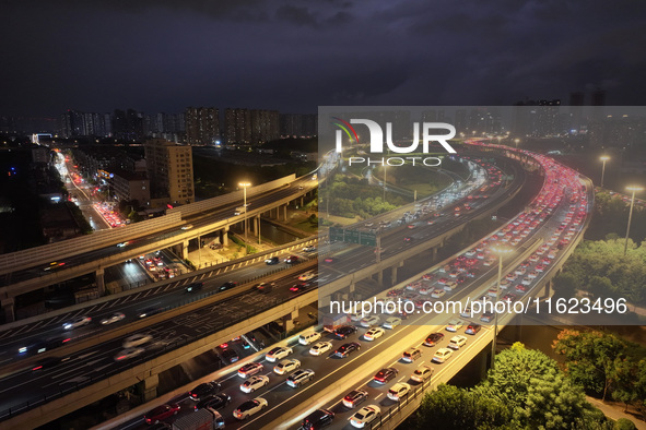 A photo taken on September 30, 2024, shows congestion on several expressways during the National Day holiday in Nanjing, China. 