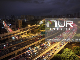 A photo taken on September 30, 2024, shows congestion on several expressways during the National Day holiday in Nanjing, China. (