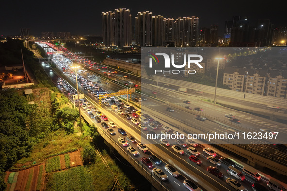 A photo taken on September 30, 2024, shows congestion on several expressways during the National Day holiday in Nanjing, China. 