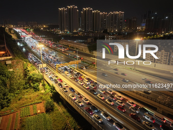 A photo taken on September 30, 2024, shows congestion on several expressways during the National Day holiday in Nanjing, China. (