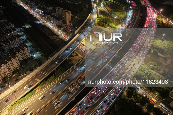 A photo taken on September 30, 2024, shows congestion on several expressways during the National Day holiday in Nanjing, China. 